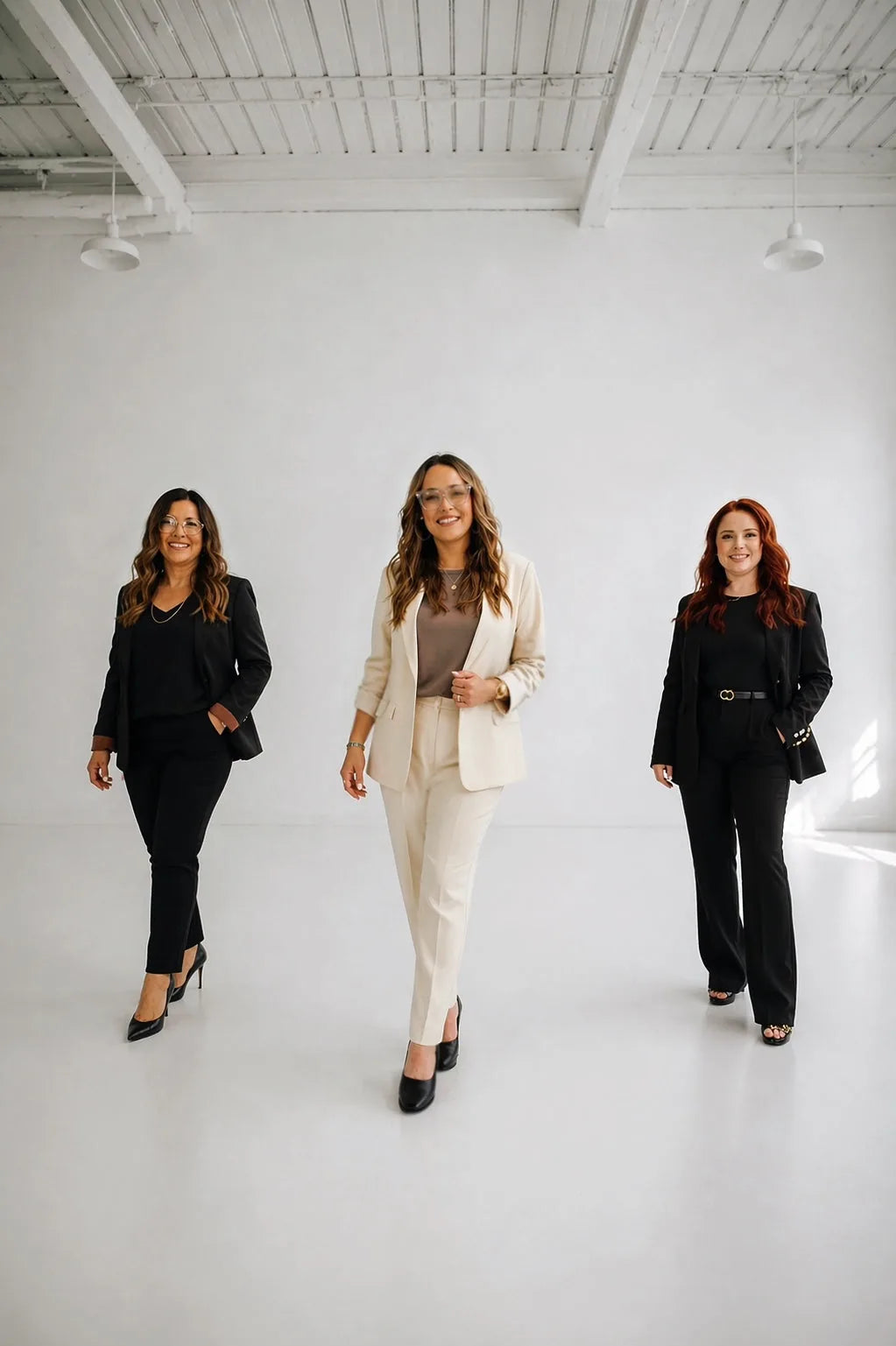 Three Simply Natural educators in a bright minimal studio