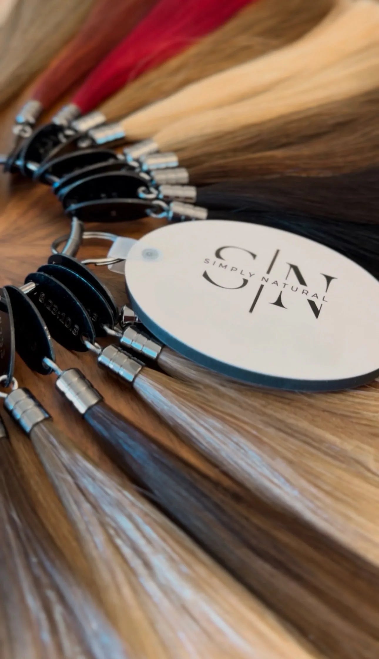 Simply Natural color ring showing the full range of hair extension shades