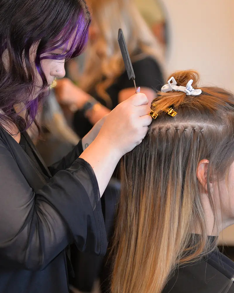 Mago stylist with a hair extension client